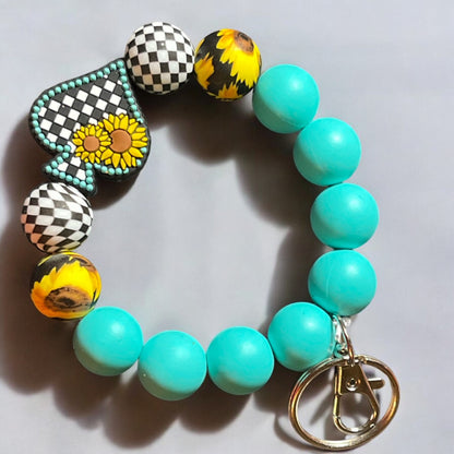 Sunflower & Checkered Beaded Wristlet Keychain - Turquoise Silicone Beads, Spade Charm, Stylish Key Ring